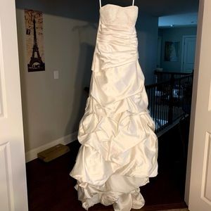 Size 8 champagne colored wedding dress. Has been taken in.